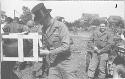 LCo Tucker gets drink of cider at ball game 1st Bn 254th Inf